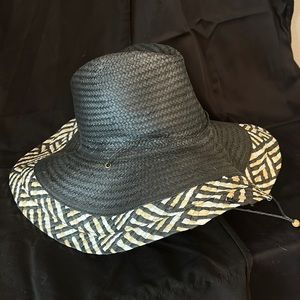 Foldable light weight straw hat. BCBG Maxazria ready for summer.